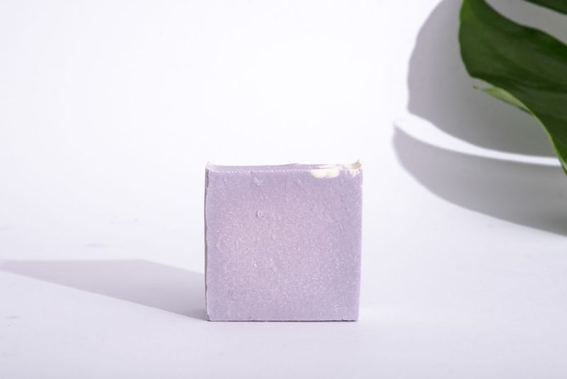 Close up of natural handmade lavender and olive oil soap on white background.